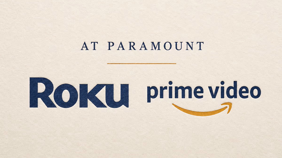 Letterpressed AT PARAMOUNT in small caps above a thin amber rule, with Roku and Prime Video wordmarks paired side by side beneath on warm ivory cotton paper.