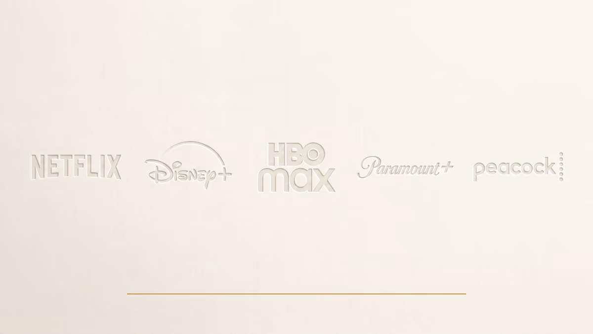 Five major streaming-service wordmarks — Netflix, Disney+, Max, Paramount+, Peacock — rendered as a fading wall, the leftmost crisp and the rightmost dissolving into the warm ivory background.